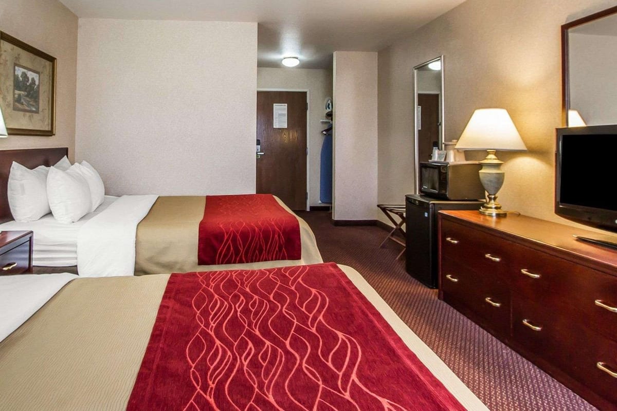 Premium bedding, desk, laptop workspace, iron/ironing board