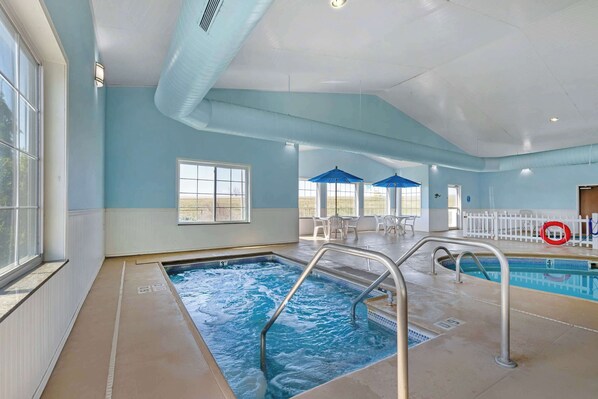 Indoor pool, open 7 AM to 10 PM, pool umbrellas