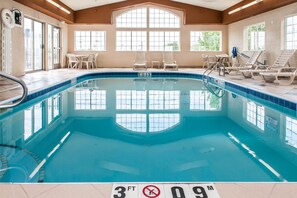 An indoor swimming pool with clear water, a 3 FT depth marker, and multiple lounge chairs around the perimeter. - Comfort Suites Columbus Expo Center (Columbus)