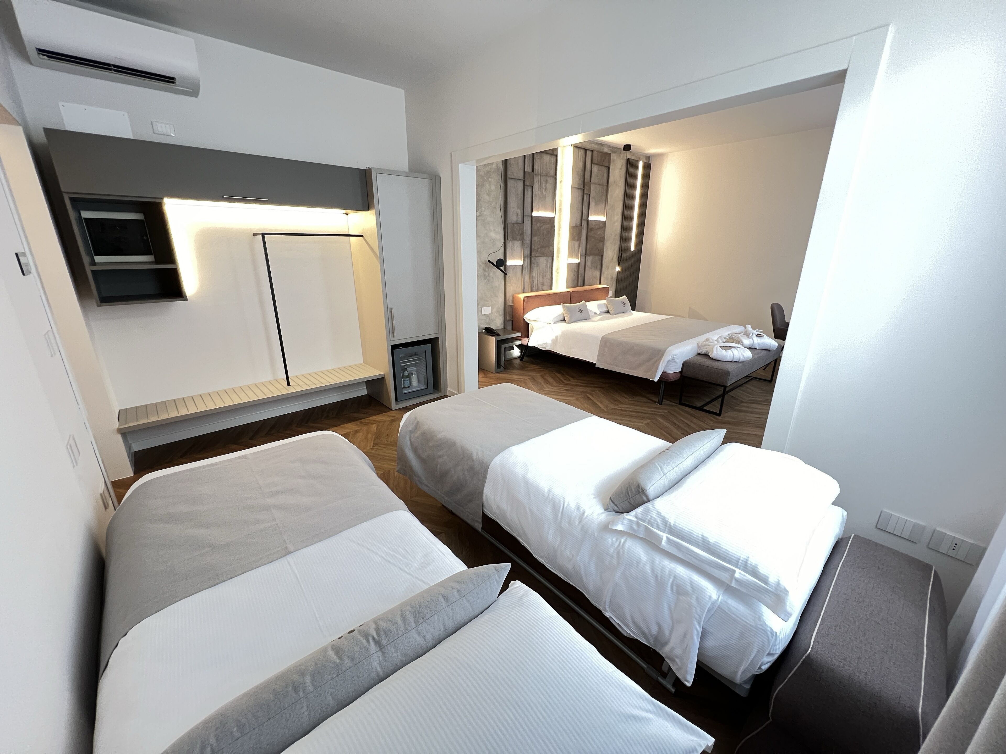 deluxe quadruple room, jetted tub | 1 bedroom, premium bedding, down duvets, in-room safe