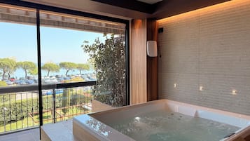 Junior Suite, Hot Tub, Partial Lake View | Premium bedding, down duvets, minibar, in-room safe