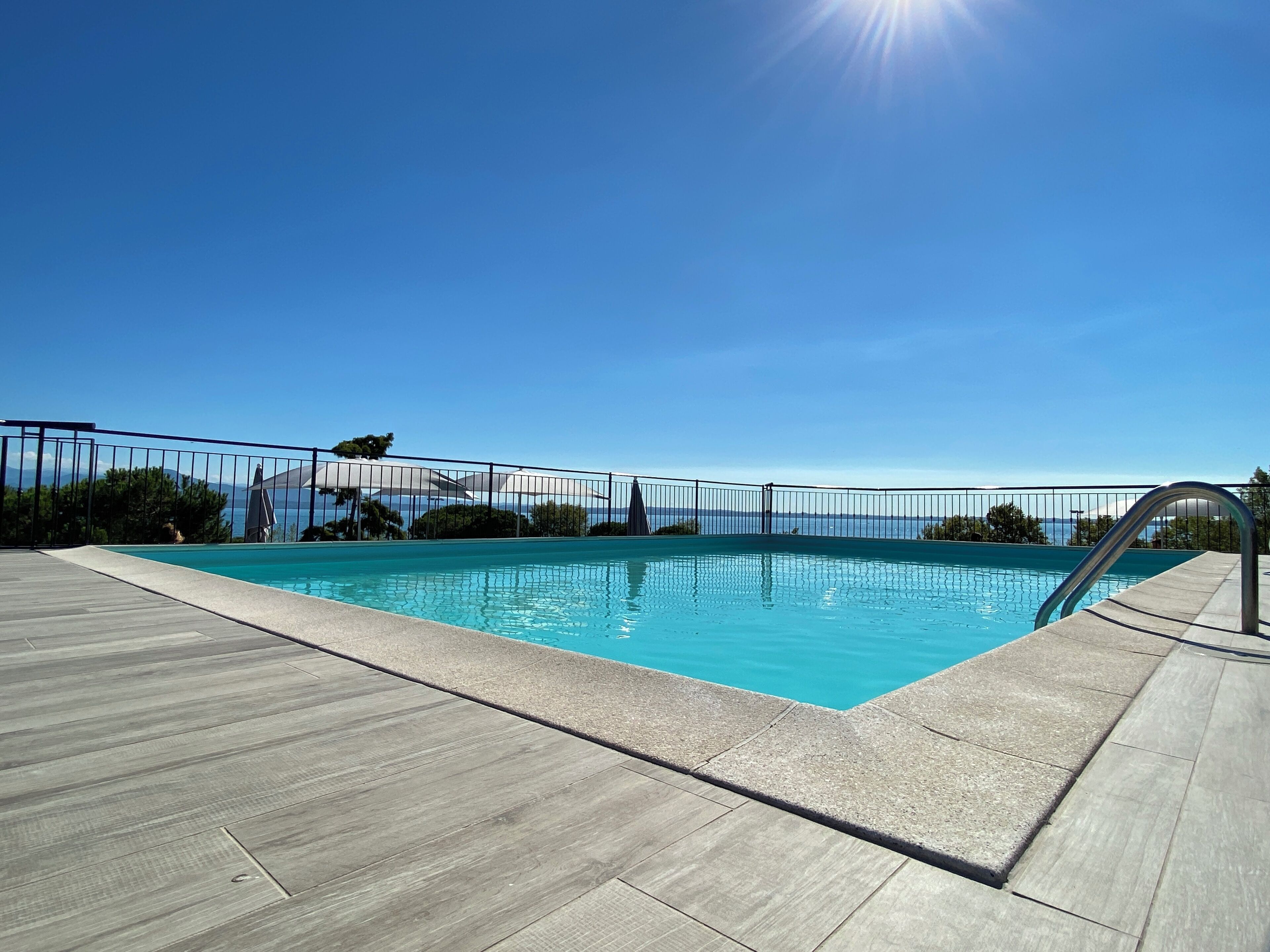 seasonal outdoor pool, open 10:00 am to 7:00 pm, pool umbrellas