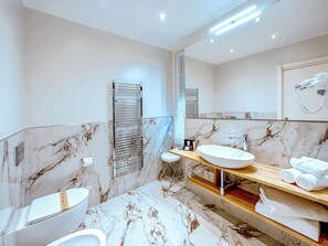 Shower, free toiletries, hair dryer, towels