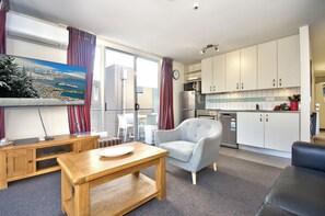 Deluxe One Bedroom Apartment | Living area