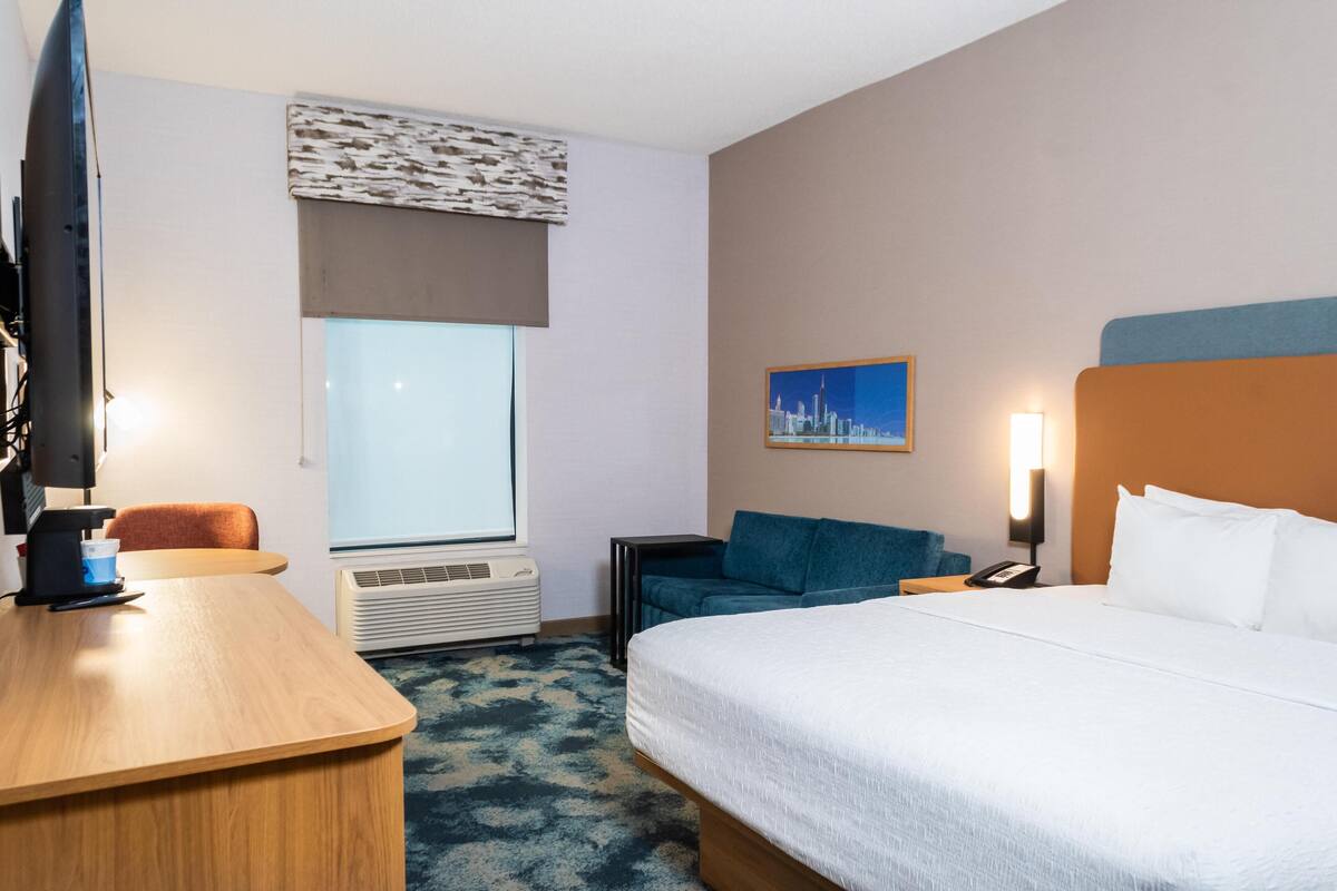 Premium bedding, desk, laptop workspace, blackout curtains