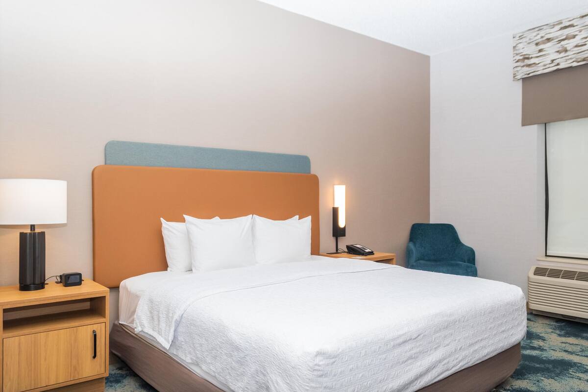 Premium bedding, desk, laptop workspace, blackout curtains