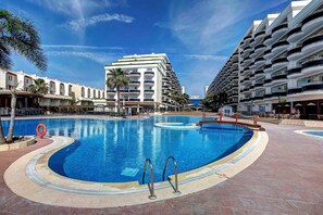 Seasonal outdoor pool, pool loungers