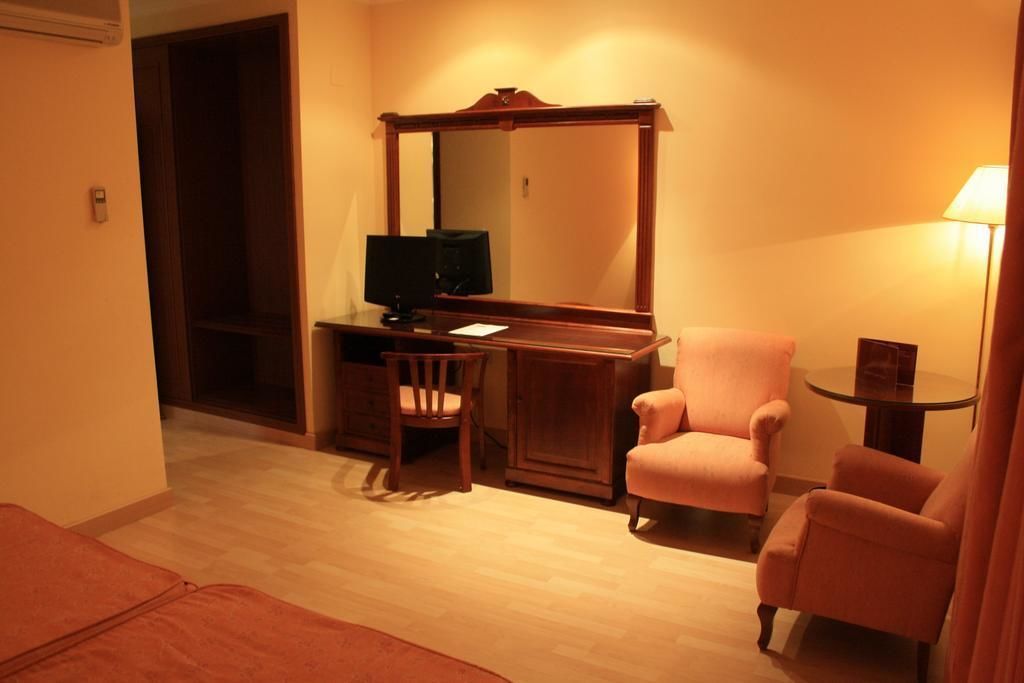 minibar, desk, laptop workspace, blackout curtains