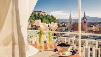 Enjoy a romantic breakfast for two on this balcony overlooking the historic town, with stunning views of the church spires and castle on the hill.