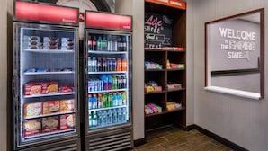 A snack and beverage vending area with a welcome sign for the Rockville Center. - Hampton Inn & Suites Rockville Centre (Rockville Centre)