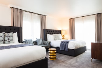 Egyptian cotton sheets, premium bedding, down comforters, in-room safe at Hotel Ella
