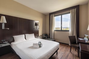 Luxe beddengoed, een minibar, een kluis op de kamer, een bureau