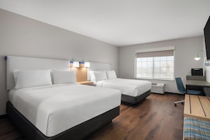 Luxe beddengoed, donsdekens, een kluis op de kamer, een bureau