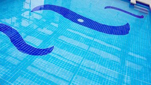 Indoor pool, open 8:00 AM to 10:00 PM, pool umbrellas