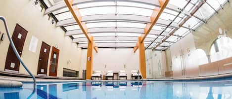 Indoor pool, open 8:00 AM to 10:00 PM, pool umbrellas