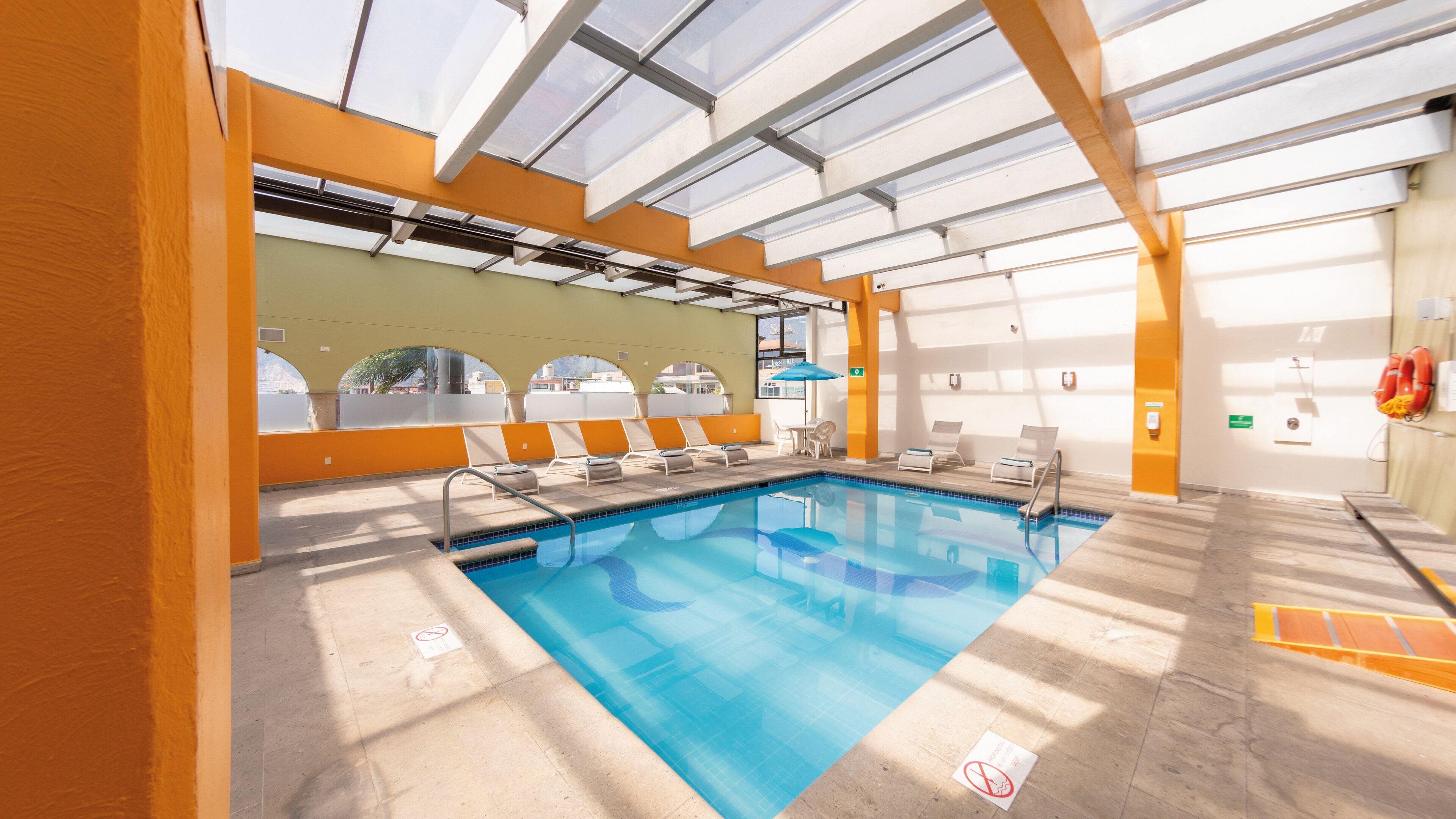 indoor pool, open 8:00 am to 10:00 pm, pool umbrellas