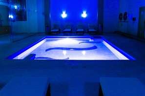 Indoor pool, open 8:00 AM to 10:00 PM, pool umbrellas