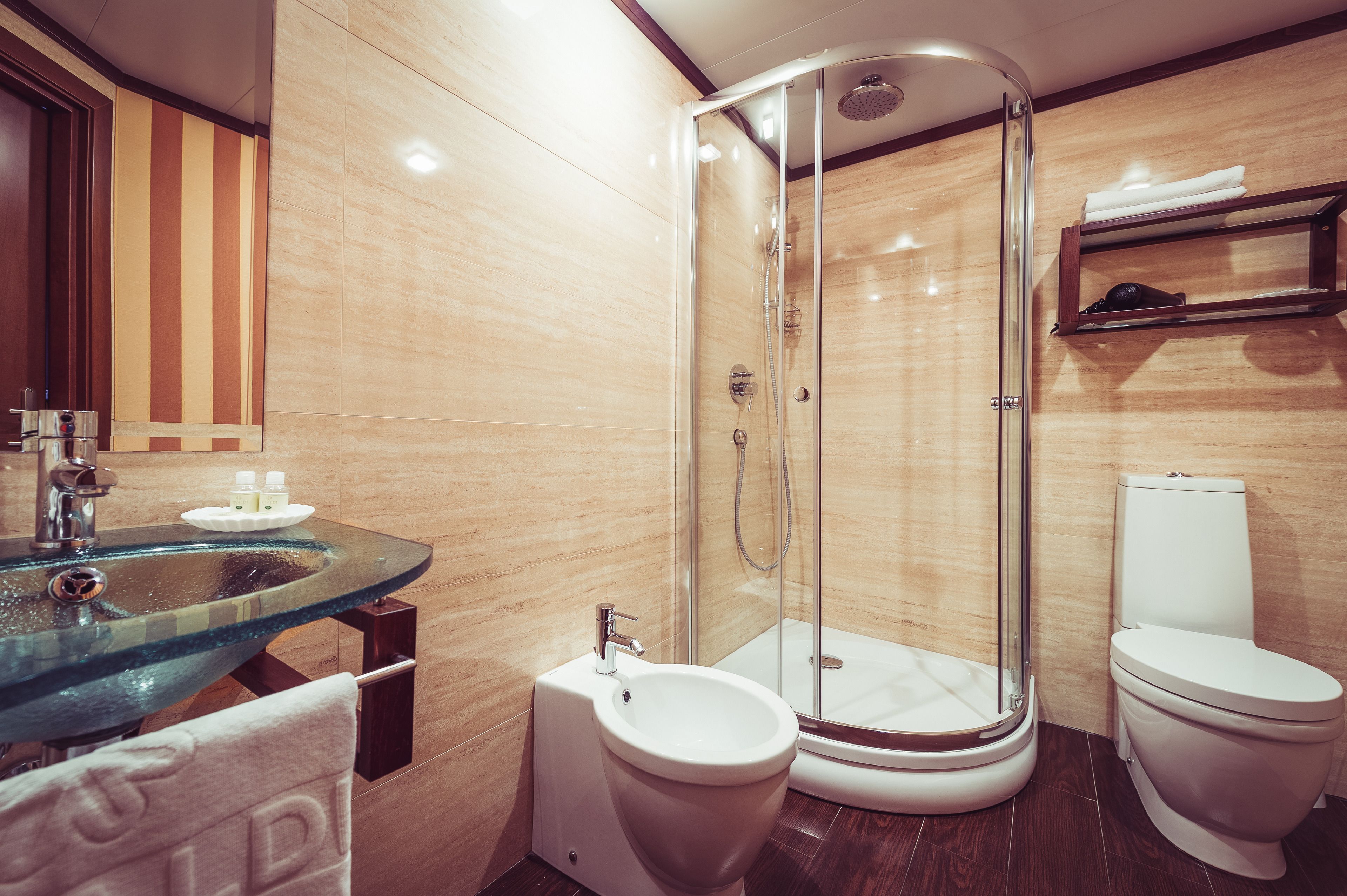 family room | bathroom | rainfall showerhead, eco-friendly toiletries, hair dryer, slippers