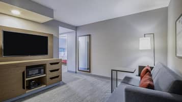 55-inch flat-screen TV with cable channels, TV