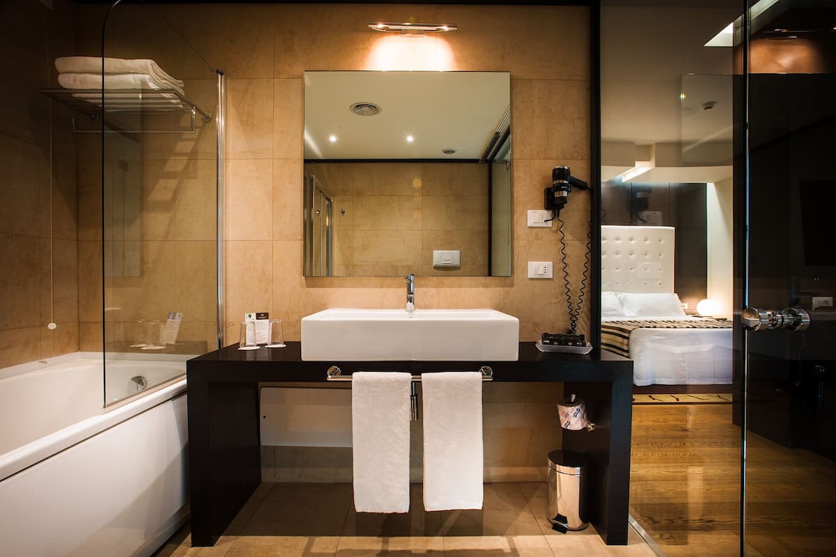 studio suite | bathroom | hair dryer, bidet, towels, soap