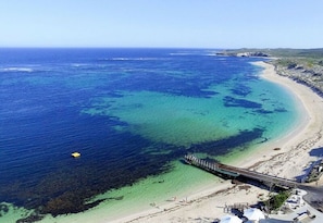 Beach nearby, white sand, beach towels