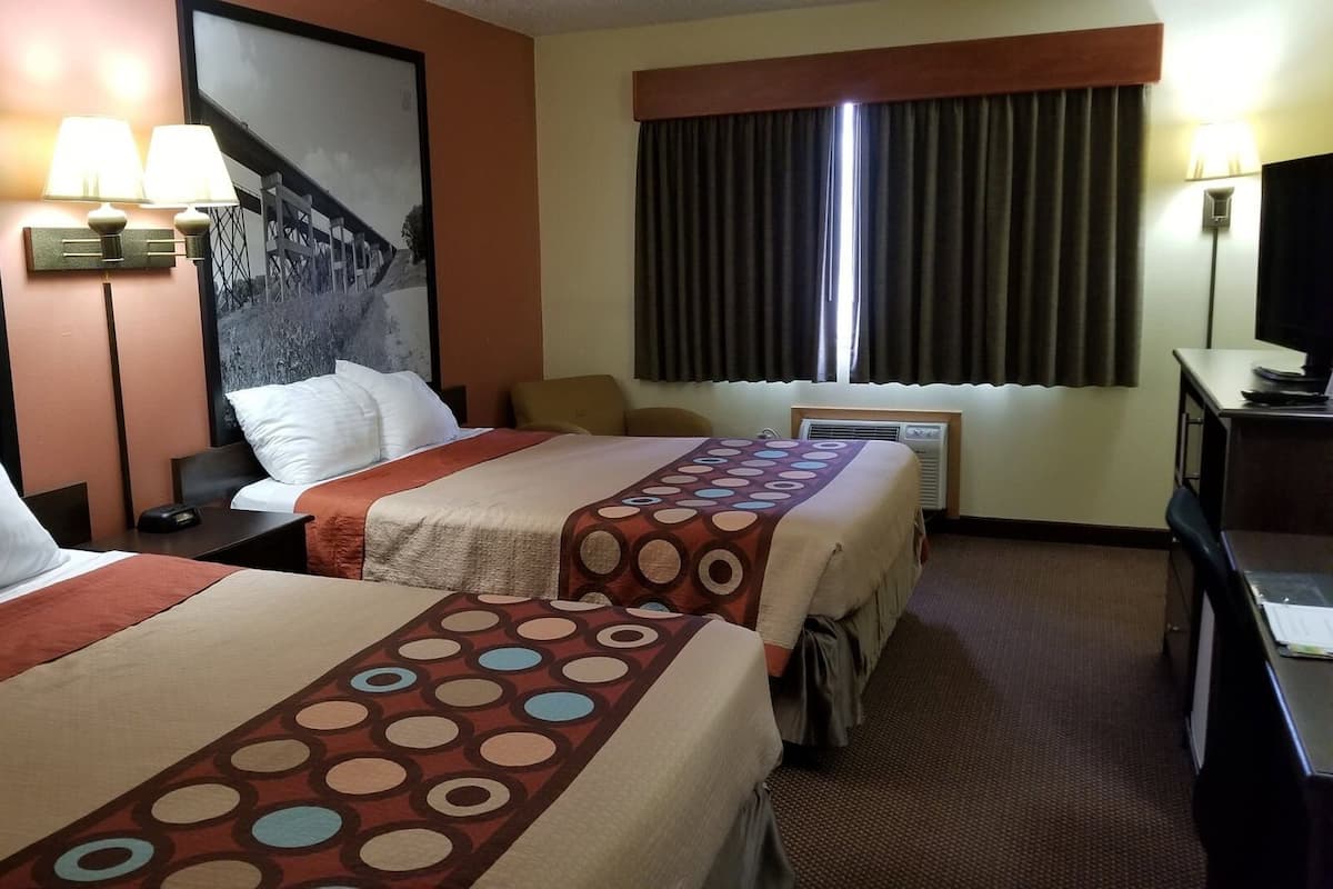 Desk, blackout drapes, iron/ironing board, free cribs/infant beds