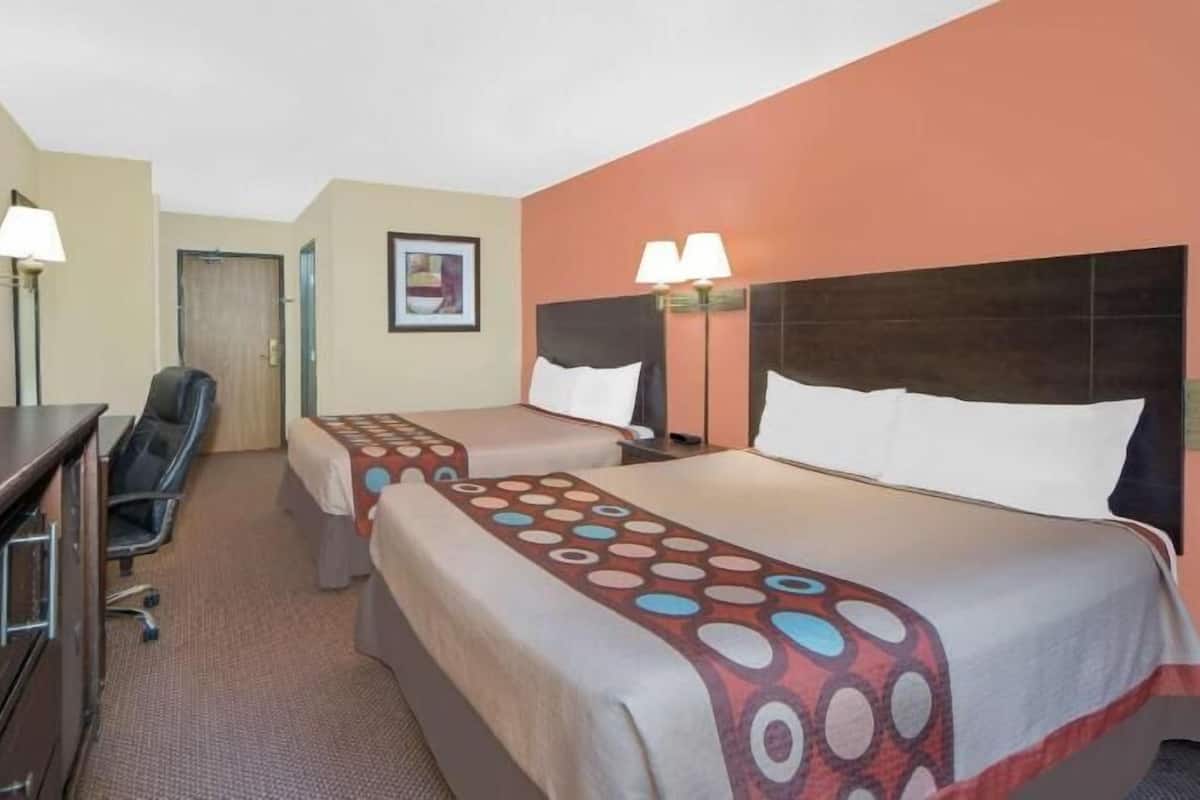 Desk, blackout drapes, iron/ironing board, free cribs/infant beds