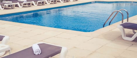 Seasonal outdoor pool, pool umbrellas, pool loungers