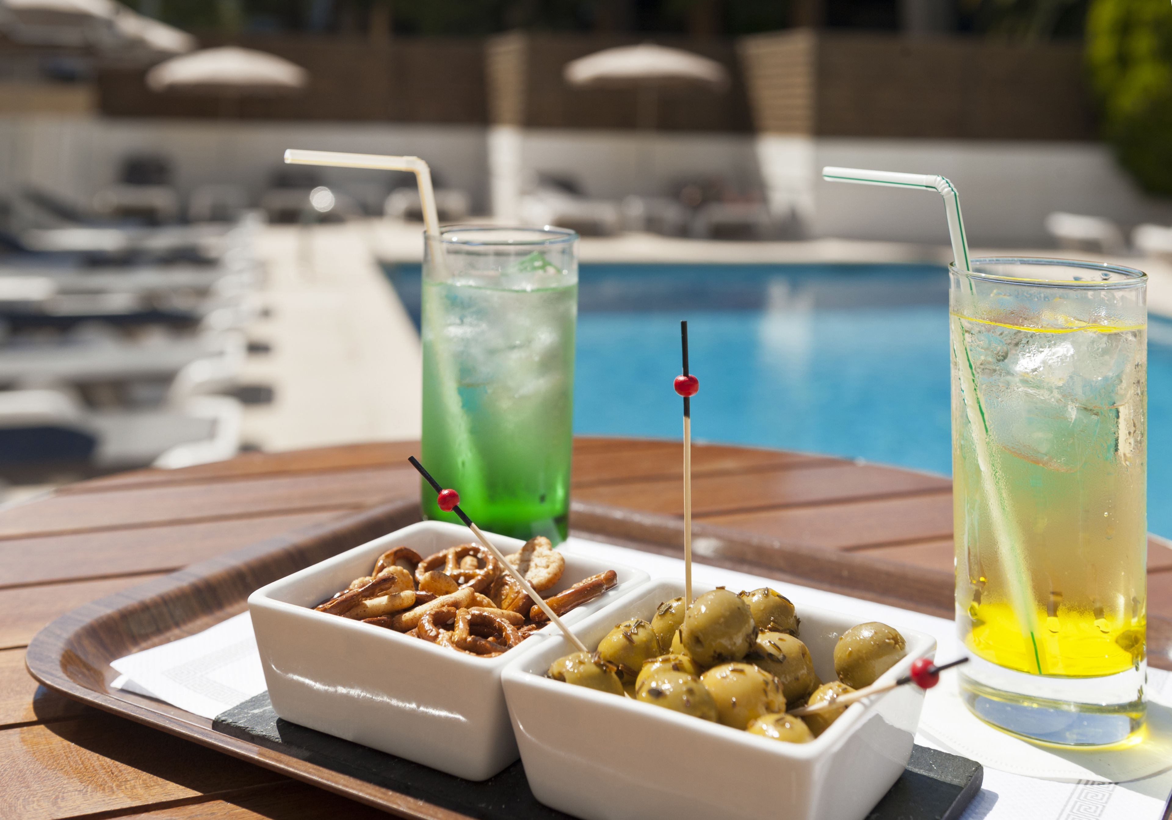 seasonal outdoor pool, open 9:00 am to 8:00 pm, pool umbrellas