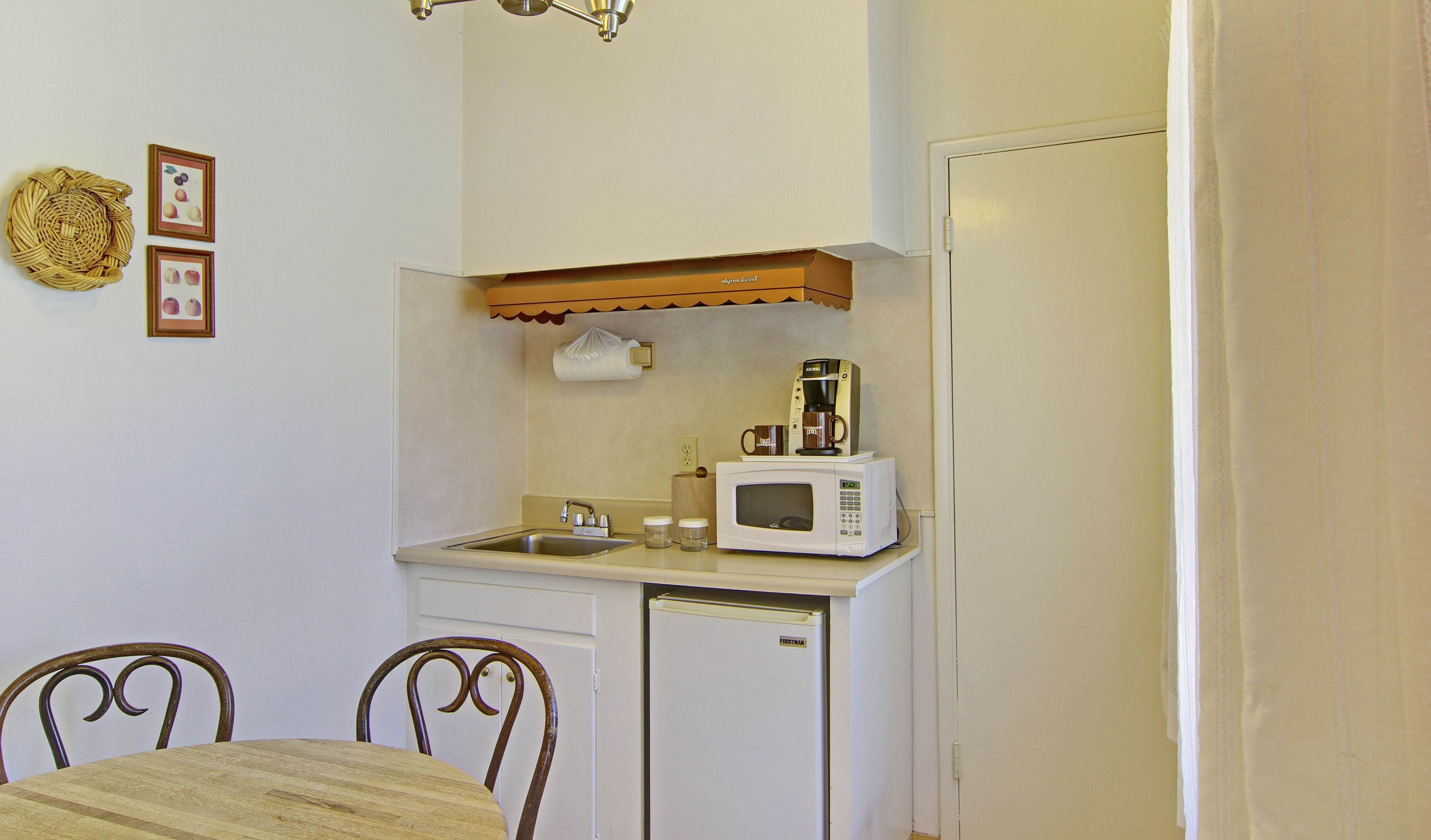 mini-fridge, coffee/tea maker, cookware/dishes/utensils