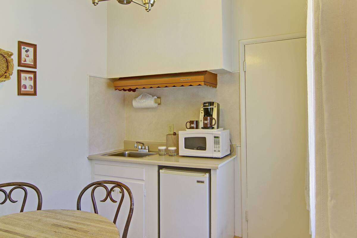 mini-fridge, coffee/tea maker, cookware/dishes/utensils