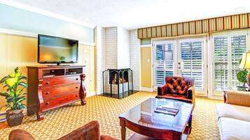 Premium Suite, 1 Bedroom, 2 Bathrooms | Living room | Flat-screen TV