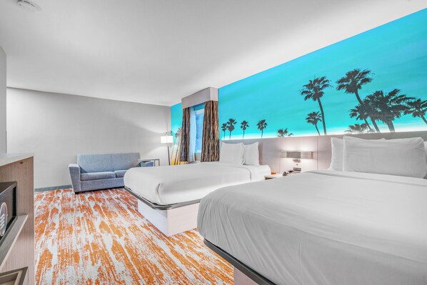 Deluxe Room, Multiple Beds (Deluxe Queen Suite) | Desk, laptop workspace, blackout drapes, iron/ironing board - Avania Inn of Santa Barbara (Santa Barbara)