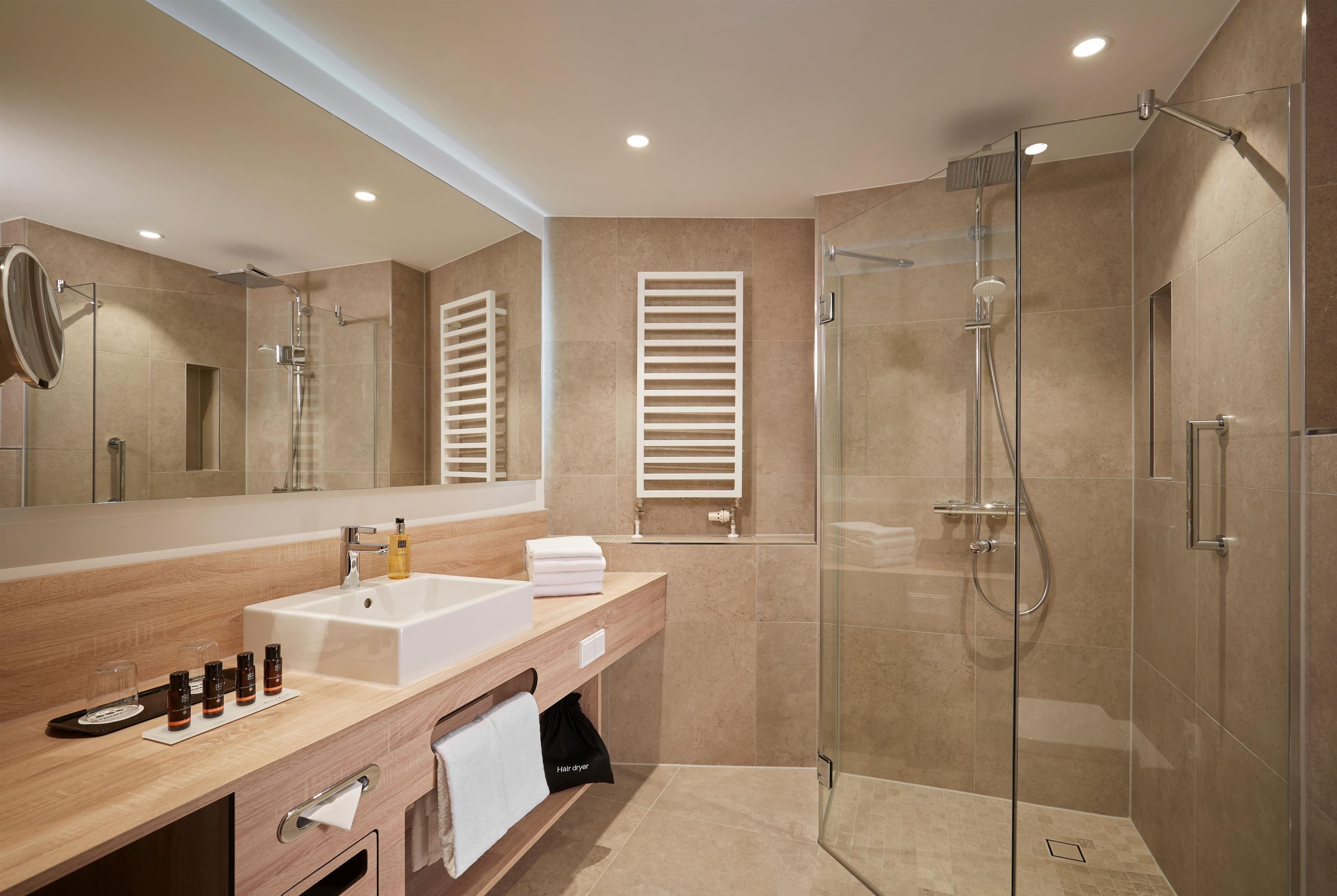 shower, hair dryer, towels, soap