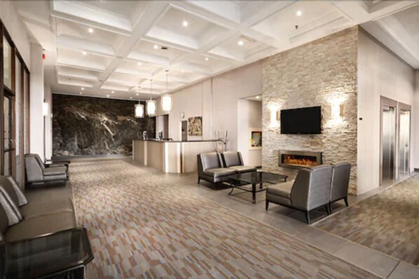 Relax in the stylish lobby with a fireplace, flat-screen TV, and comfortable seating.