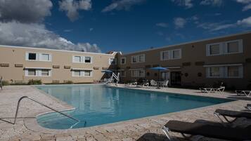 Outdoor pool, open 10:00 AM to 10:00 PM, sun loungers