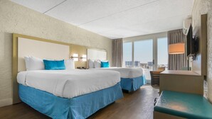 A hotel room with two beds, a desk, a chair, and a large window. - Inn on Destin Harbor, an Ascend Collection Hotel (Destin)