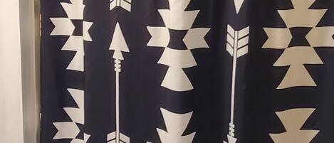 A shower curtain with a geometric pattern.