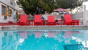 Seasonal outdoor pool, open 9:00 AM to 9:00 PM, pool umbrellas