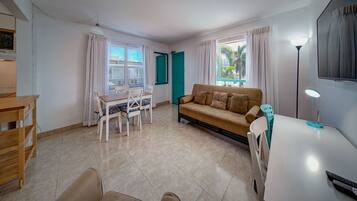 Standard Suite, 1 Bedroom | Living area | 43-inch Smart TV with cable channels