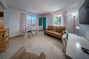 Standard Suite, 1 Bedroom | Living area | 43-inch Smart TV with cable channels