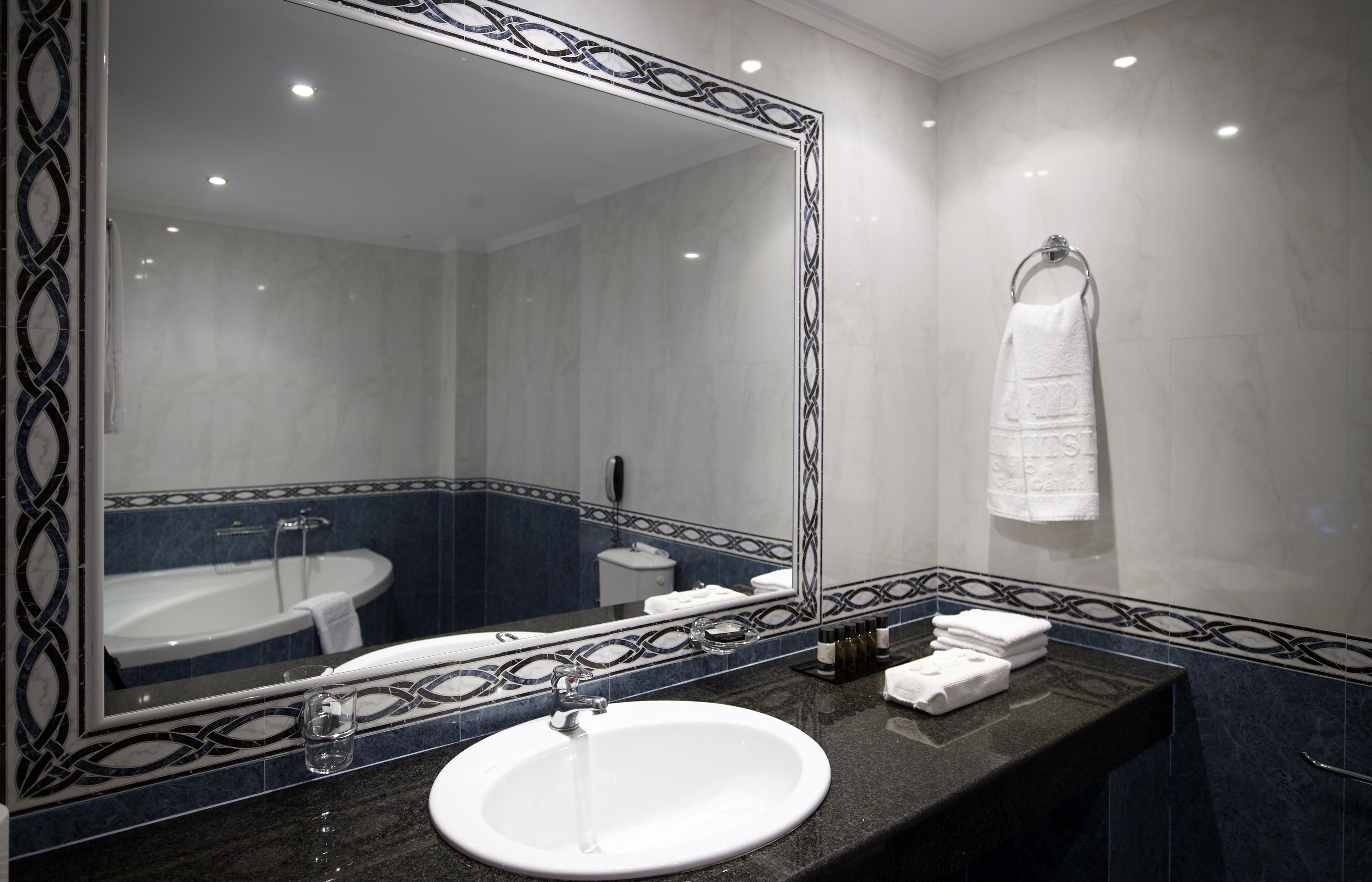 bathtub, hair dryer, bathrobes, slippers