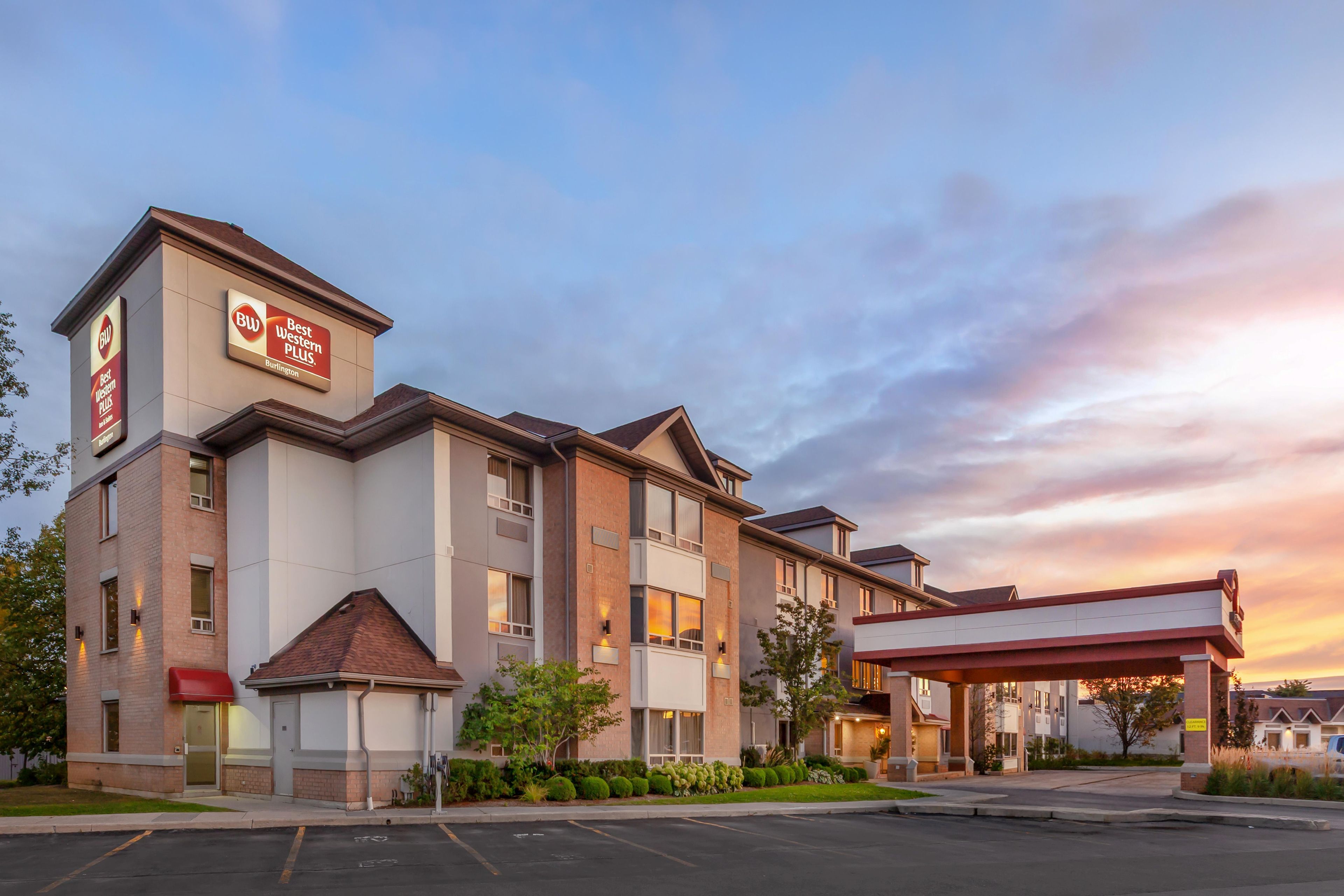 A hotel with a modern design, featuring a prominent signage for 'Best Western Plus'.