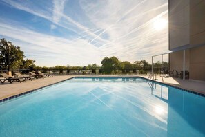 Seasonal outdoor pool, pool loungers