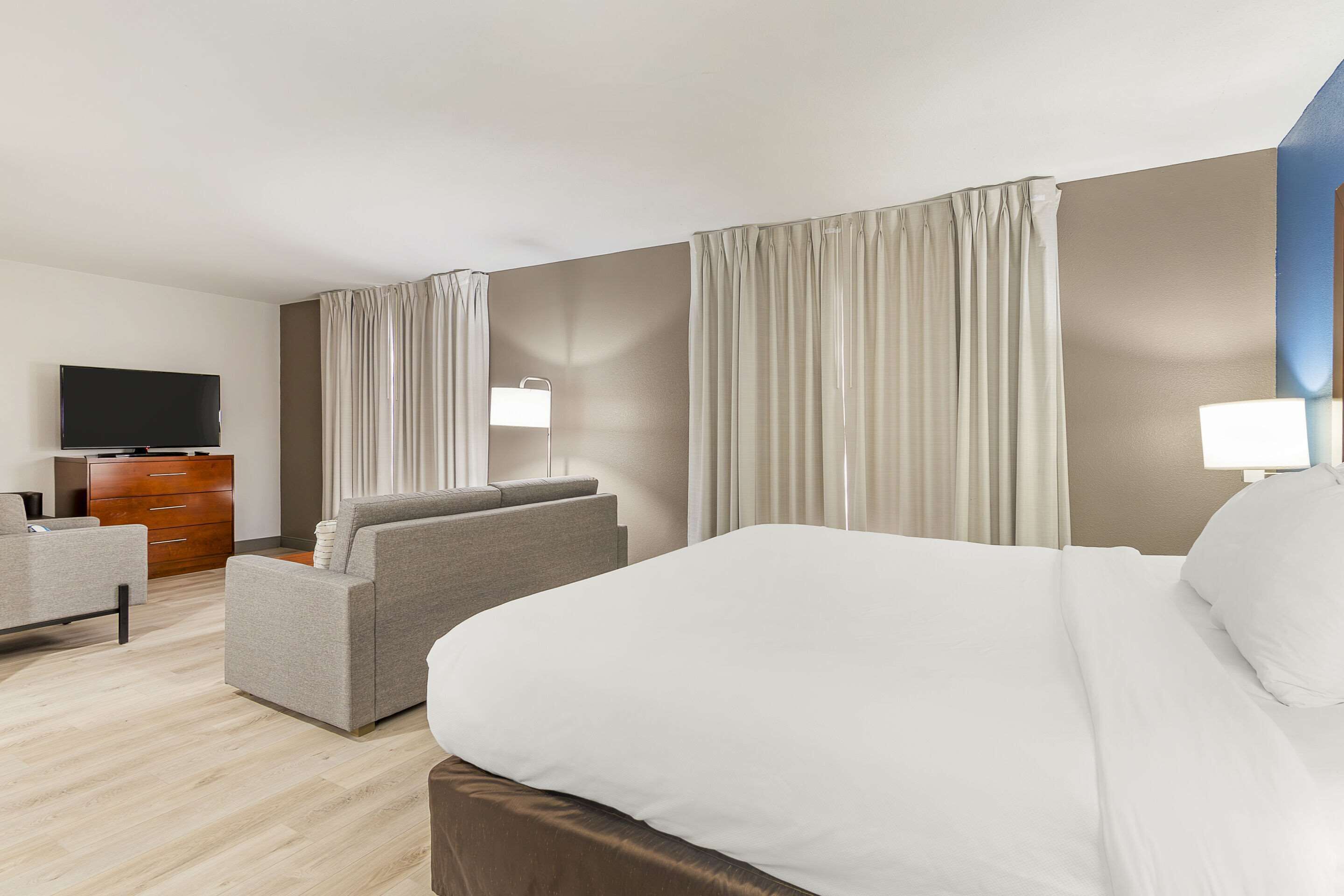 desk, laptop workspace, blackout curtains, iron/ironing board