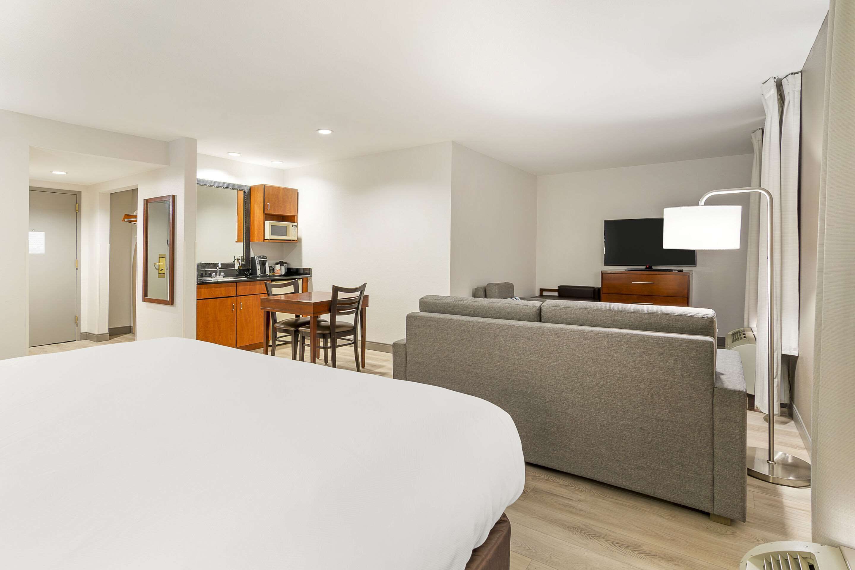 desk, laptop workspace, blackout curtains, iron/ironing board