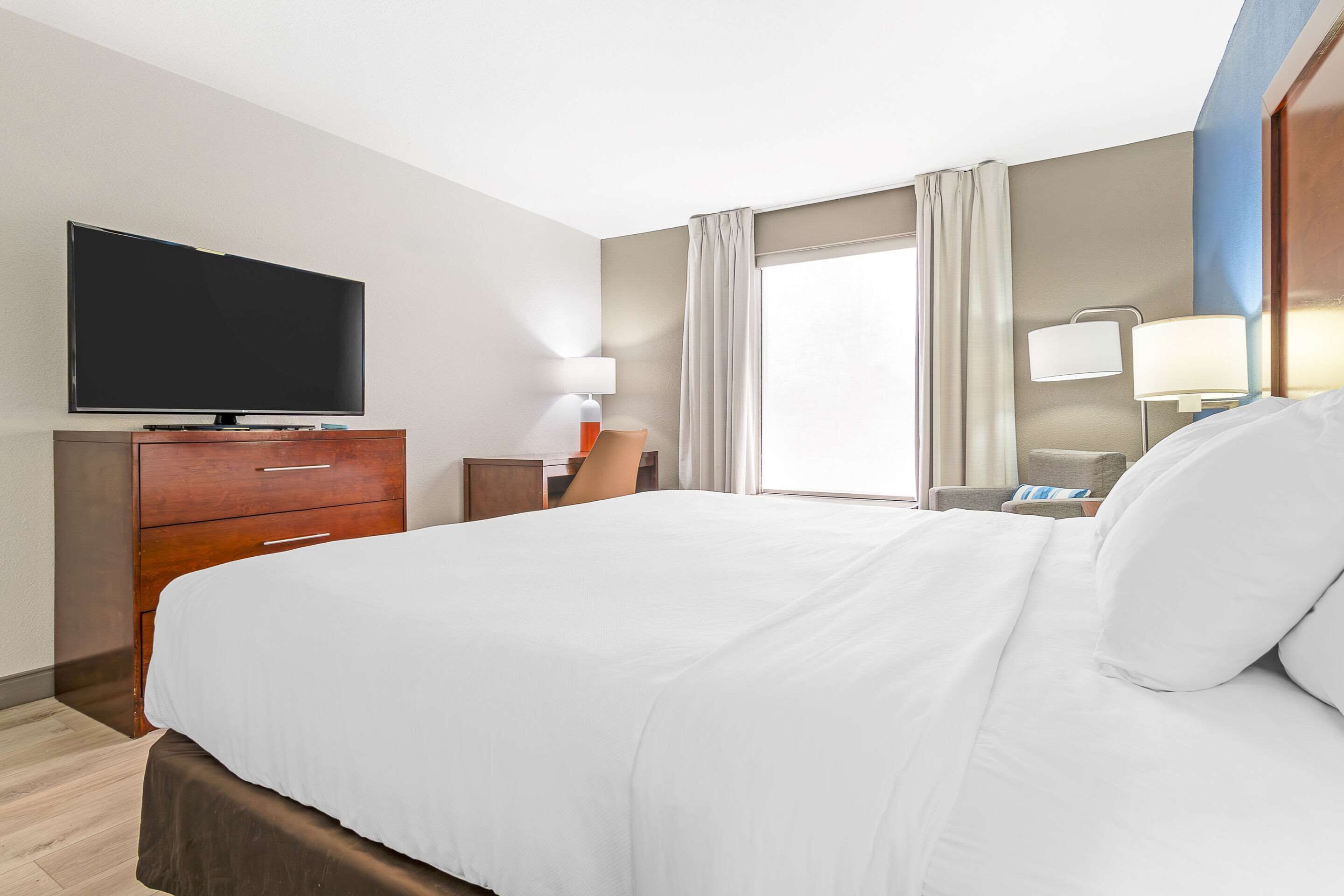 desk, laptop workspace, blackout curtains, iron/ironing board