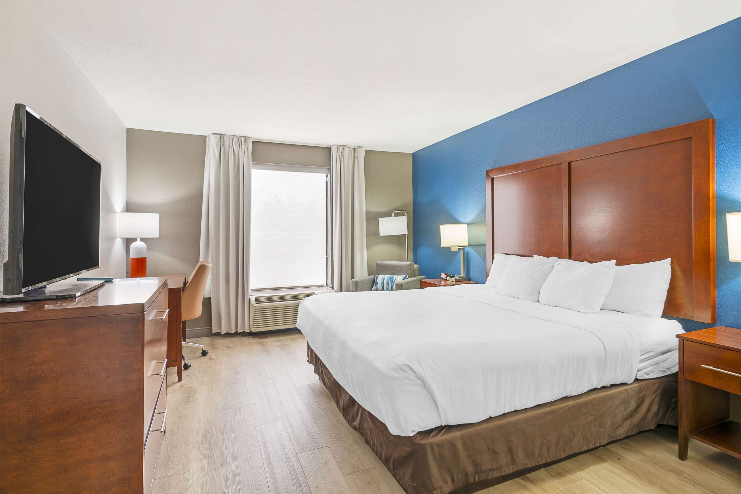 desk, laptop workspace, blackout curtains, iron/ironing board