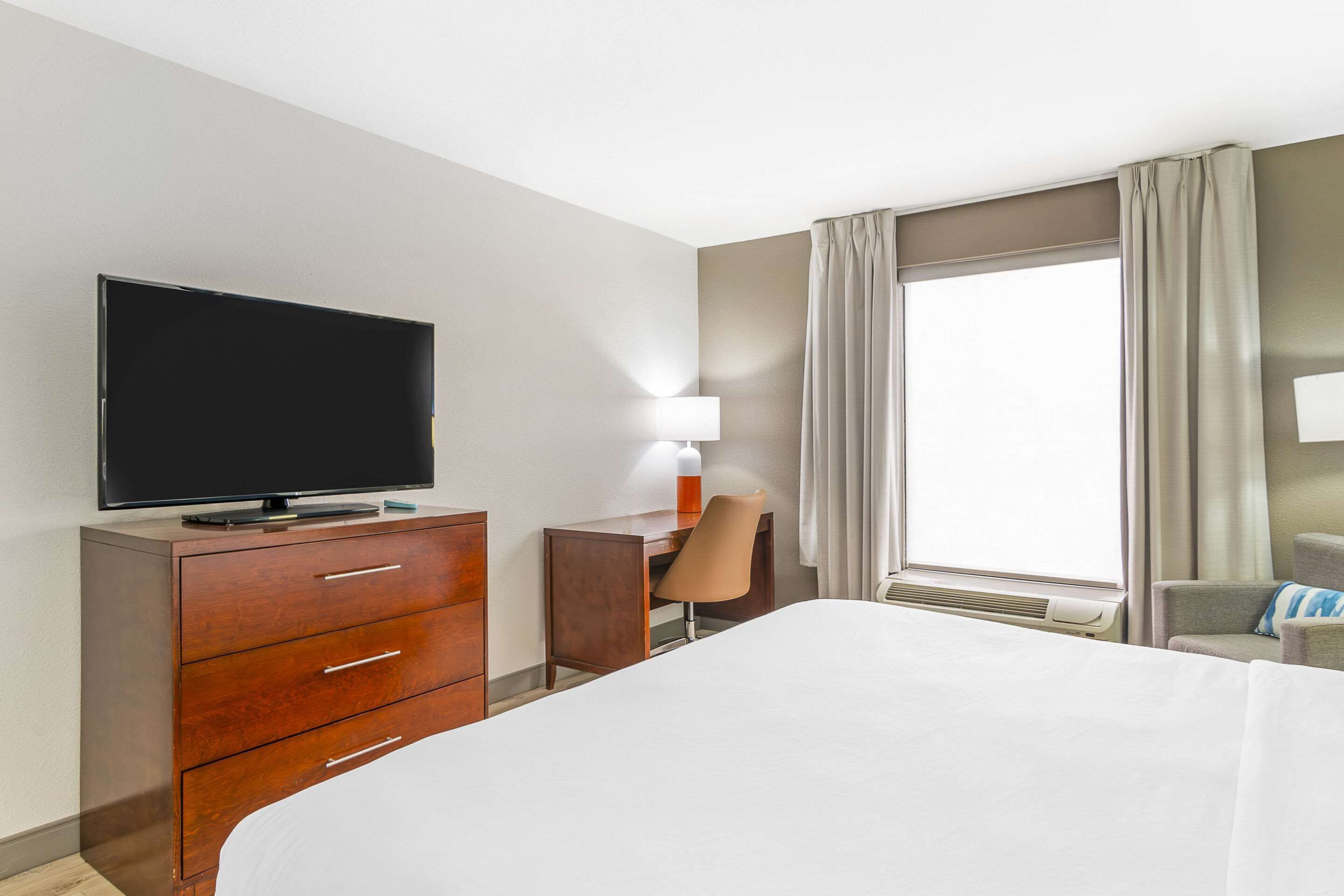 desk, laptop workspace, blackout curtains, iron/ironing board