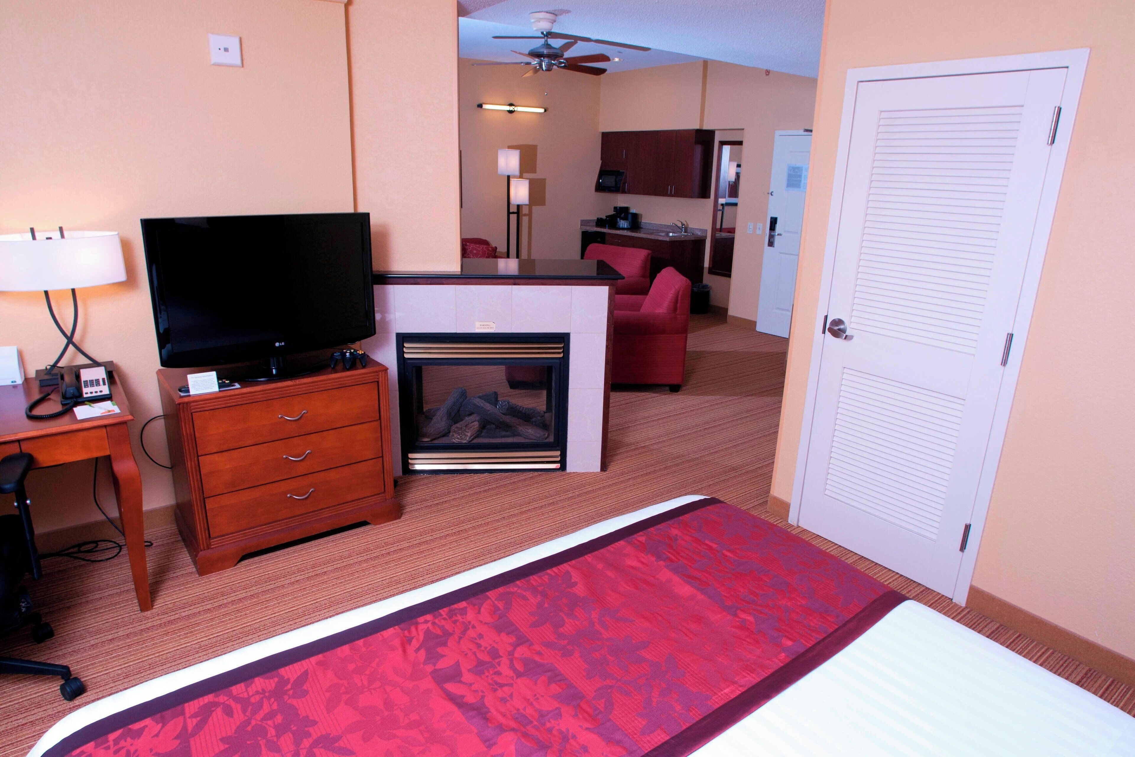 suite, 1 king bed with sofa bed, fireplace | in-room safe, desk, iron/ironing board, cots/infant beds